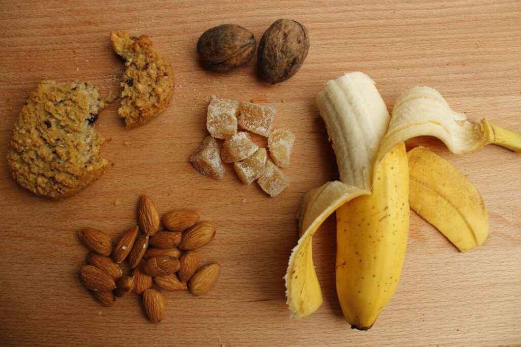 A person choosing cool soft foods from a bowl beside dental implant recovery instructions.